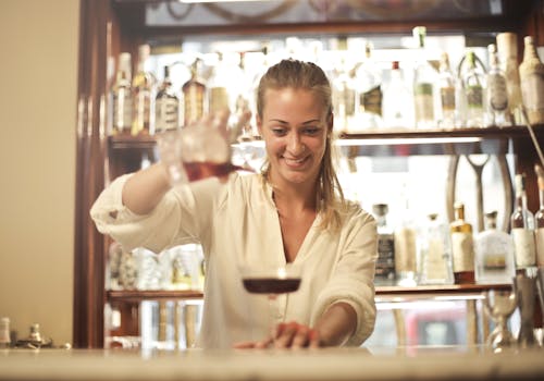 restaurant staff smiling and serving customers