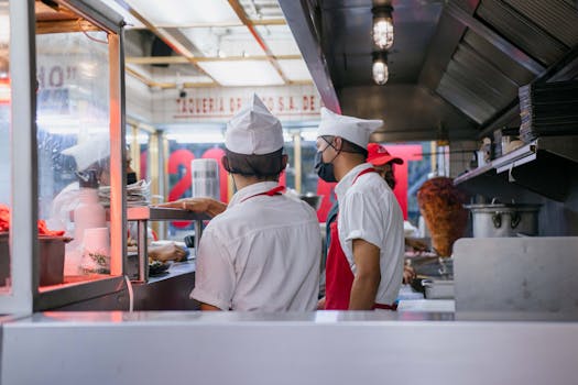 restaurant workers at busy kitchen